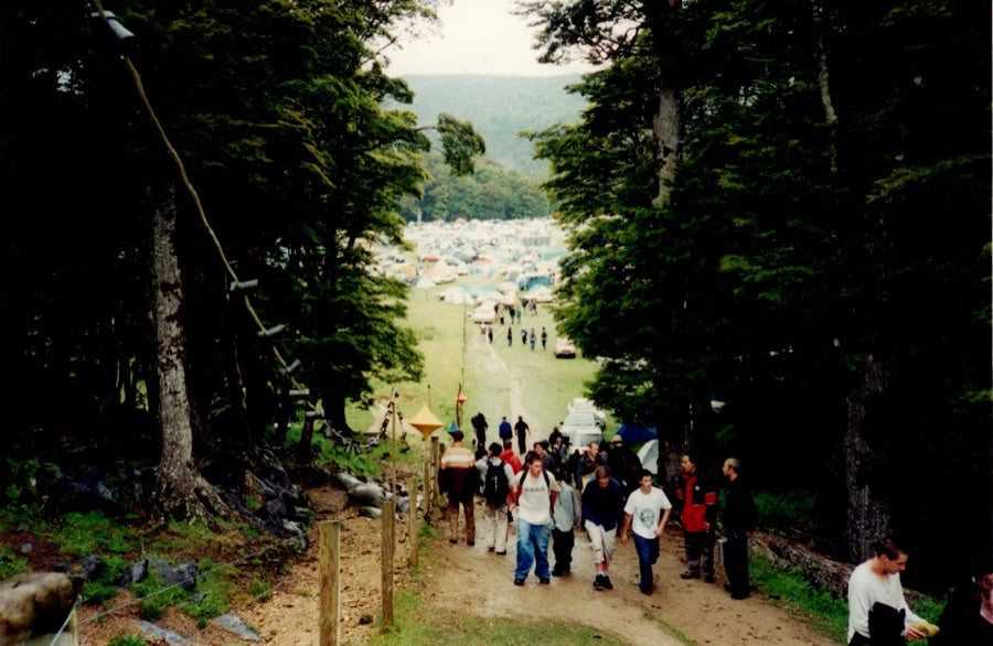 The walk in to a festival, tents in the valley below
